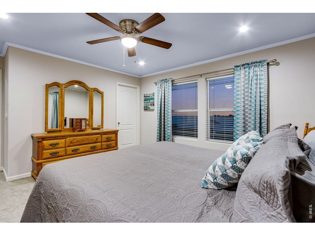Property Photo 25 Primary bedroom with retreat features incredible views, ceiling fan