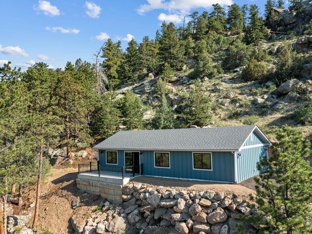 Property Photo 1 Beautifully designed and thoughtfully remodeled mountain retreat on one acre offering the perfect blend of modern comfort and natural beauty
