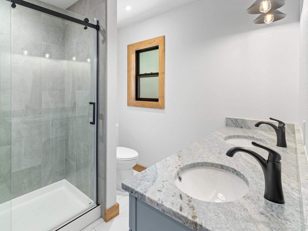 Property Photo 18 Primary suite with walk in shower and double sinks