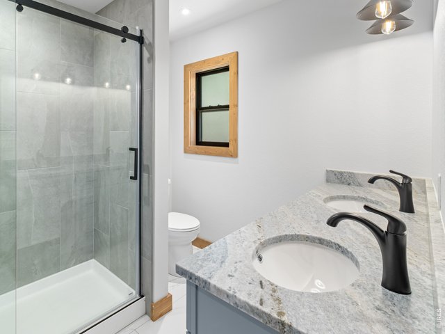 Property Photo 18 Primary suite with walk in shower and double sinks