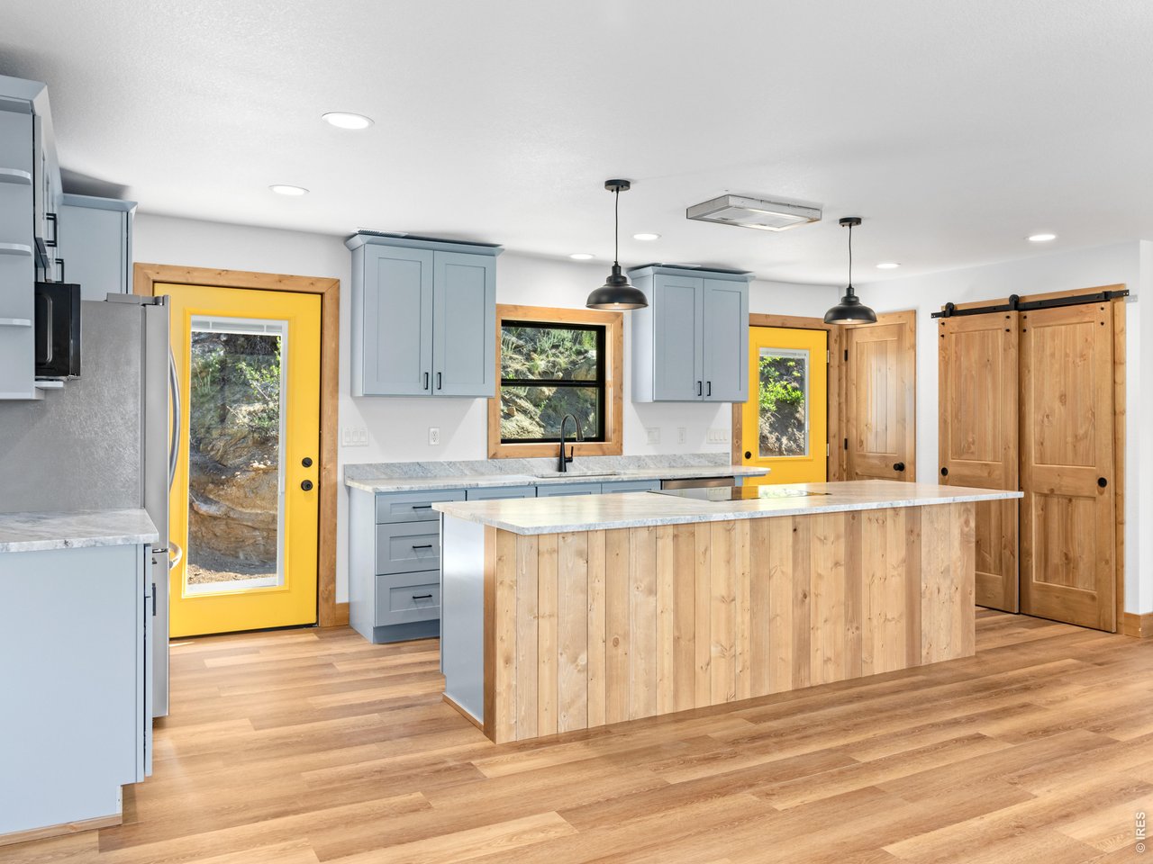 Property Photo 5 The open-concept floor plan is ideal for both everyday living and entertaining