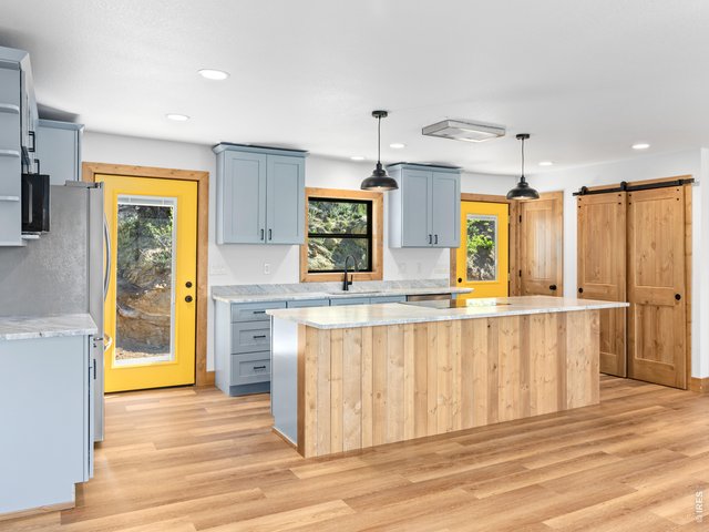 Property Photo 5 The open-concept floor plan is ideal for both everyday living and entertaining