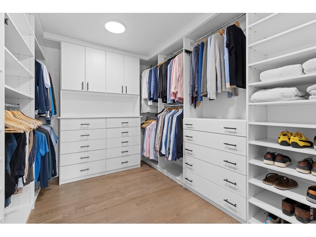 Property Photo 28 Primary Closet w/Custom Built-ins 