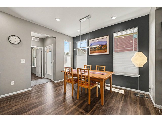 Property Photo 10 Dining Space and Side Entryway To Patio