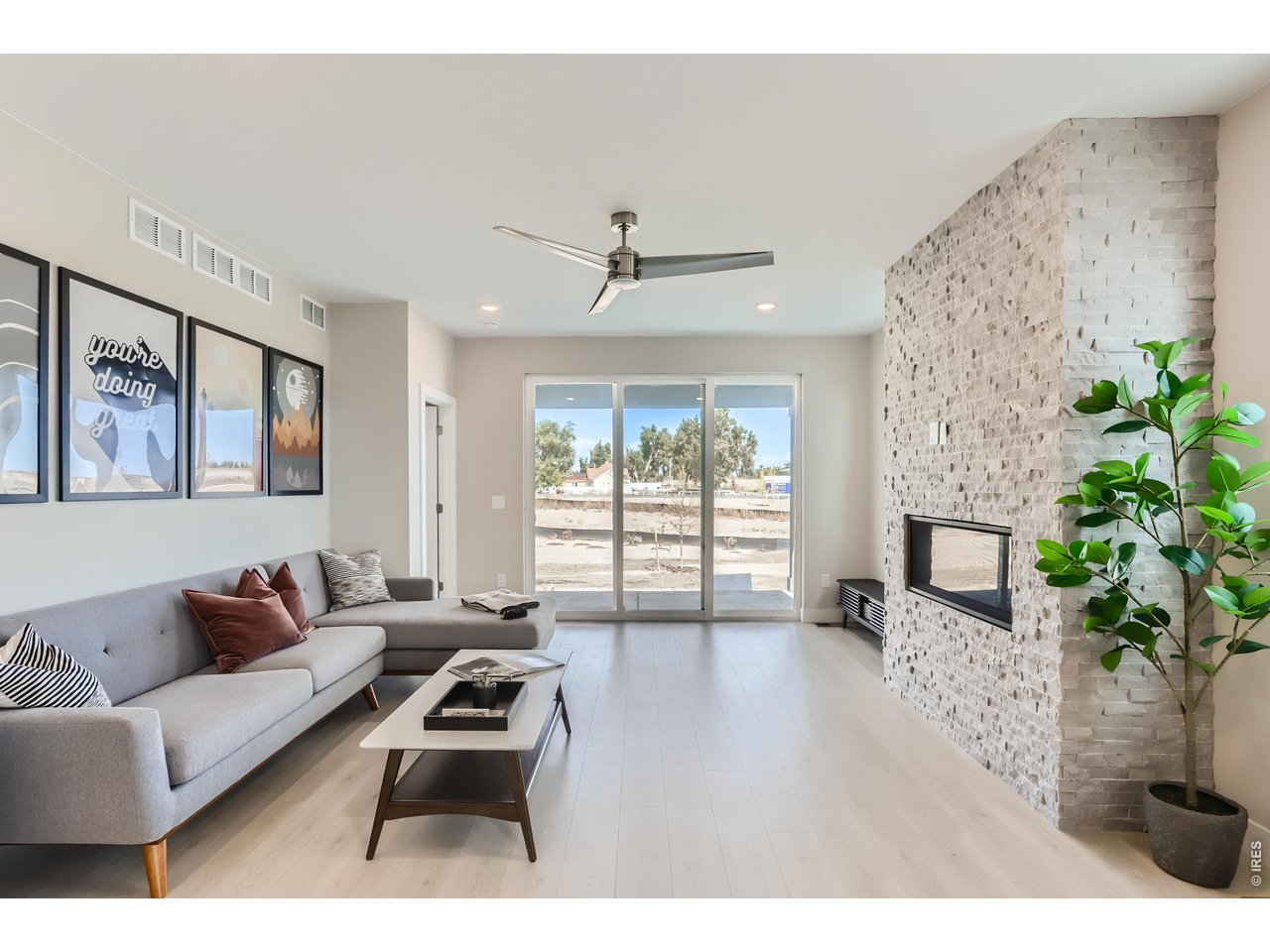 Property Photo 9 Living Room with a view to patio & back yard
