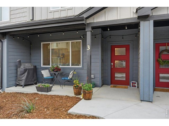 Property Photo 20 Red front door, covered porch, and room for your morning coffee spot.