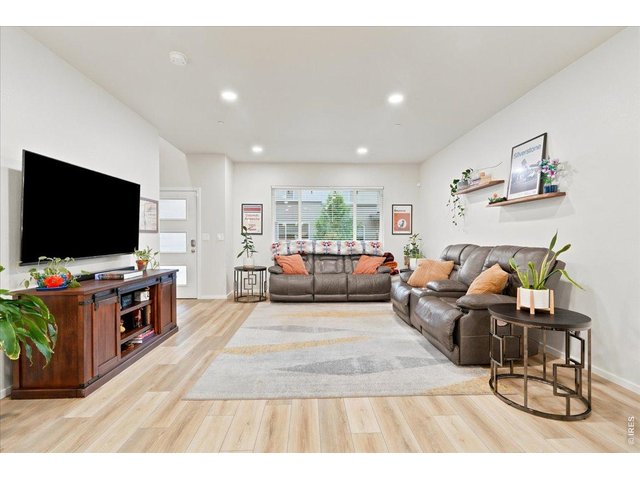 Property Photo 7 Open-concept living with luxury vinyl plank flooring and tons of natural light.