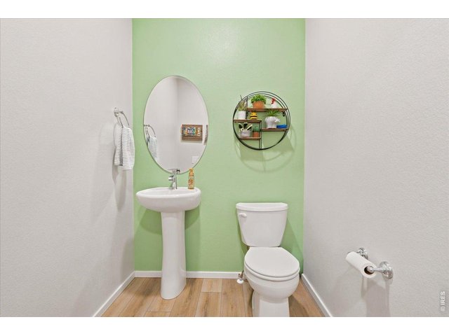 Property Photo 8 A fun pop of color in the powder bath. Because not every room has to be neutral.