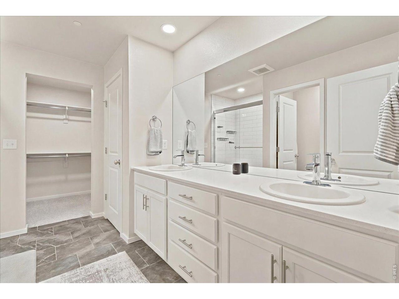 Property Photo 10 Dual sinks, quartz counters, and a walk-in shower. Your own private retreat.