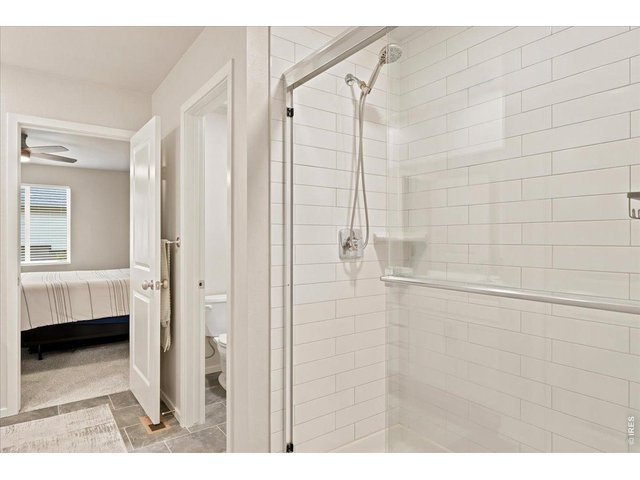 Property Photo 11 Primary suite walks straight into the ensuite and walk-in closet. No detail missed.