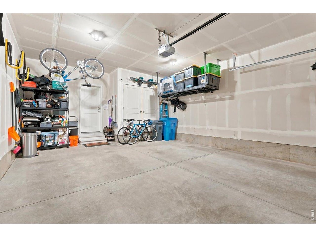 Property Photo 16 Two-car garage with built-in storage. Room for the bikes, the gear, and everything in between.