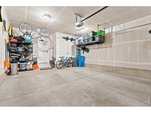 Property Photo 16 Two-car garage with built-in storage. Room for the bikes, the gear, and everything in between.