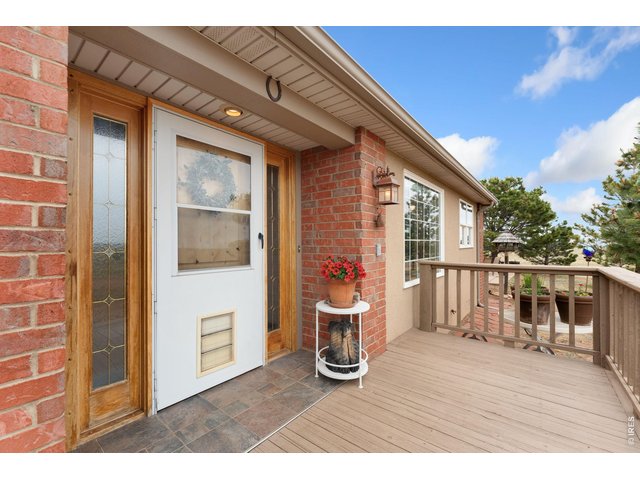 Property Photo 3 Welcoming front porch with beautiful views
