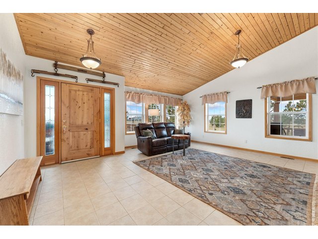 Property Photo 5 Warm wood finishes in the spacious family room