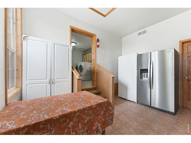 Property Photo 23 Large Mud/Utility room with both exterior and garage entrances for easy access.