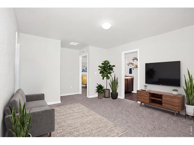 Property Photo 17 The loft "hub" of the upstairs has endless possibilities! Seen here as a 2nd TV/Media area...