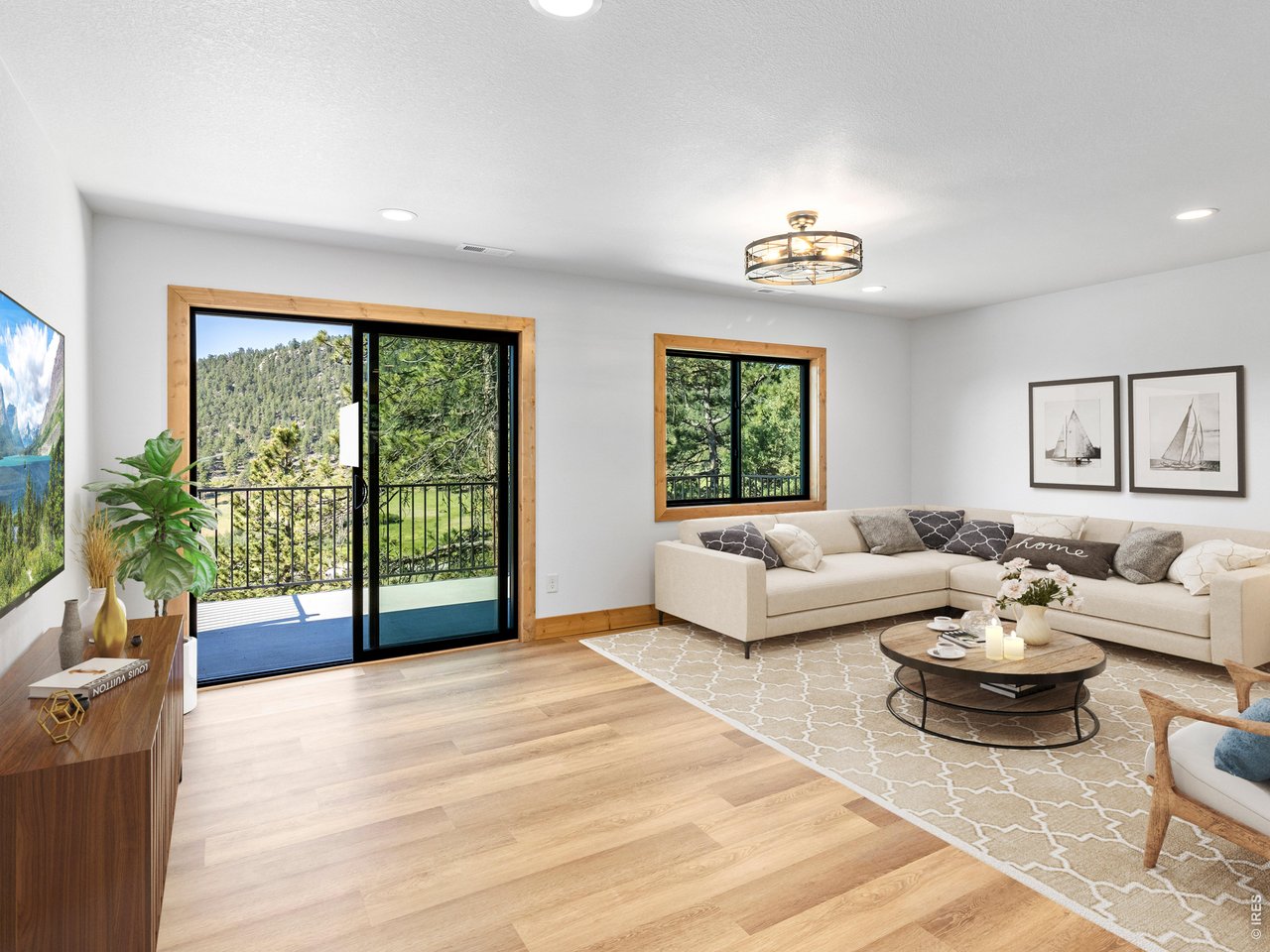 Property Photo 14 The seamless flow between the kitchen, dining, and living areas creates an inviting space filled with natural light and framed by stunning views