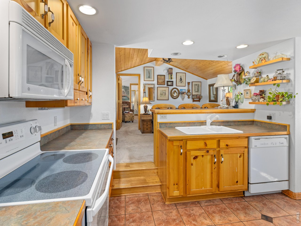 Property Photo 7 Kitchen is open to the living area.