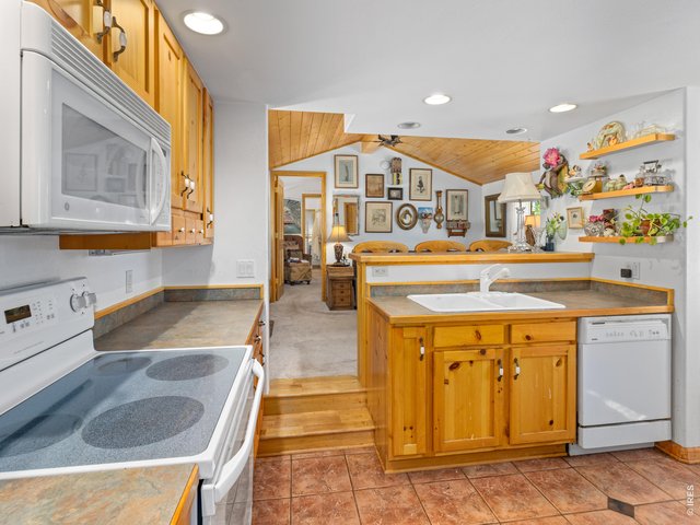 Property Photo 7 Kitchen is open to the living area.