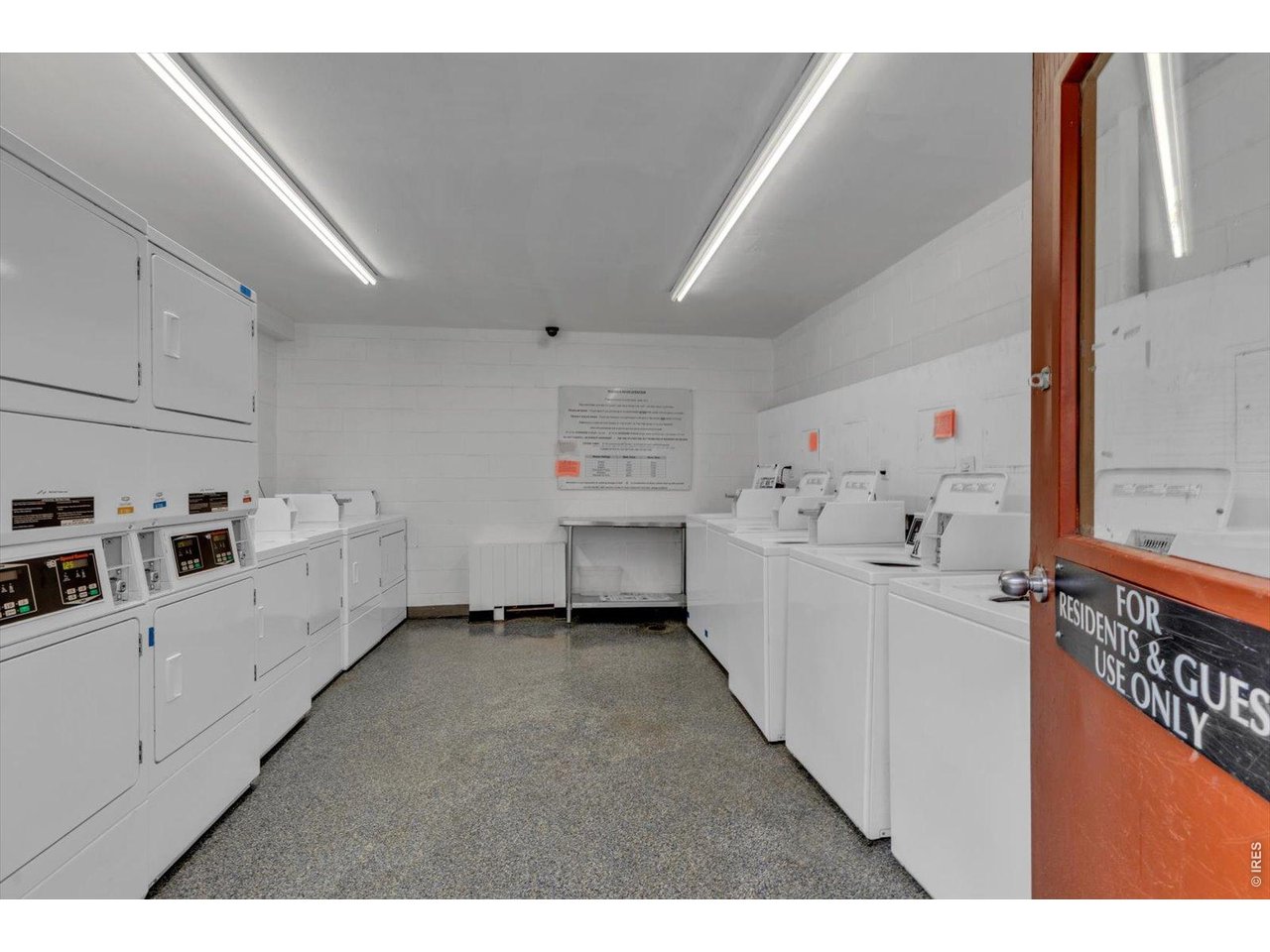Clean and well lit laundry room near by.