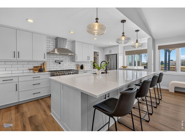 Property Photo 10 8 Burner Gas Cooktop & Large Island