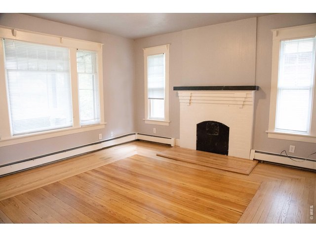 Property Photo 6 Beautiful fireplace on the main floor. (Fireplace does not currently work)