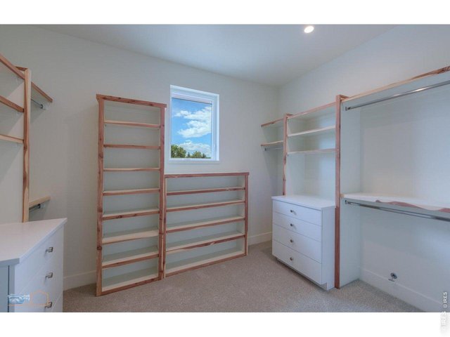 Property Photo 18 Very Large Primary Bedroom Closet: Example Of Primary Bedroom Closet From Previous House In Trail Ridge West