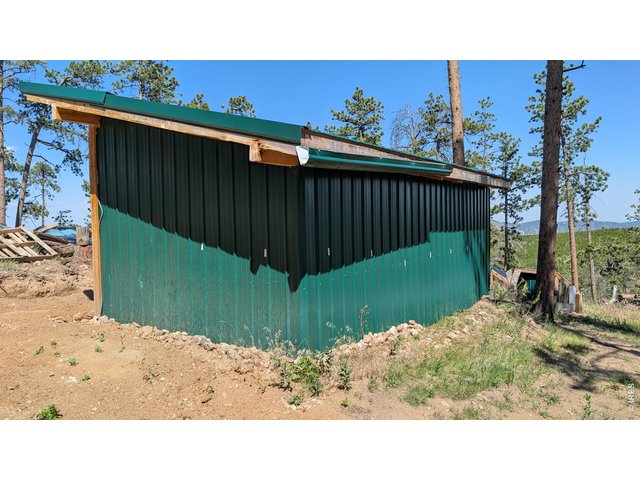 Property Photo 31 Sides, rear and roof are metal