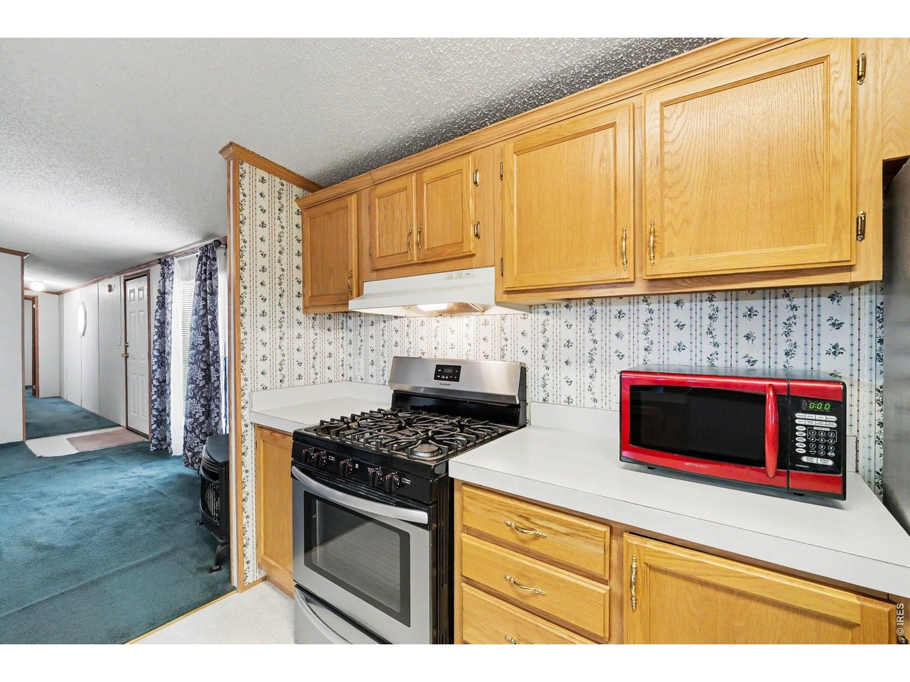 Property Photo 12 Stainless steel gas range and refrigerator, microwave, dishwasher, washer and dryer included.