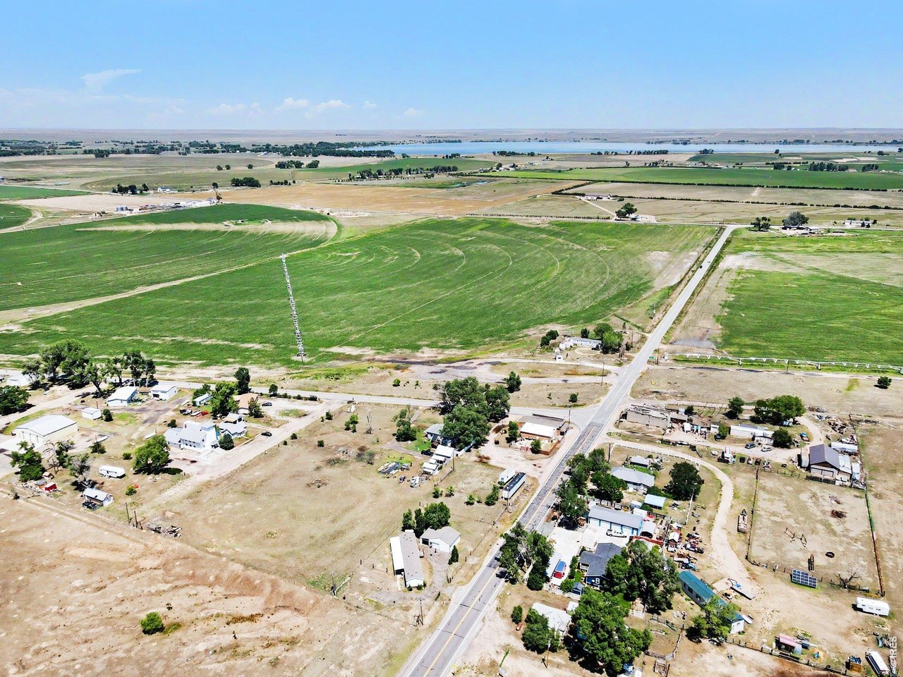 Property Photo 2 Aerial view from the home looking toward the lake; yes, that's how close it is!