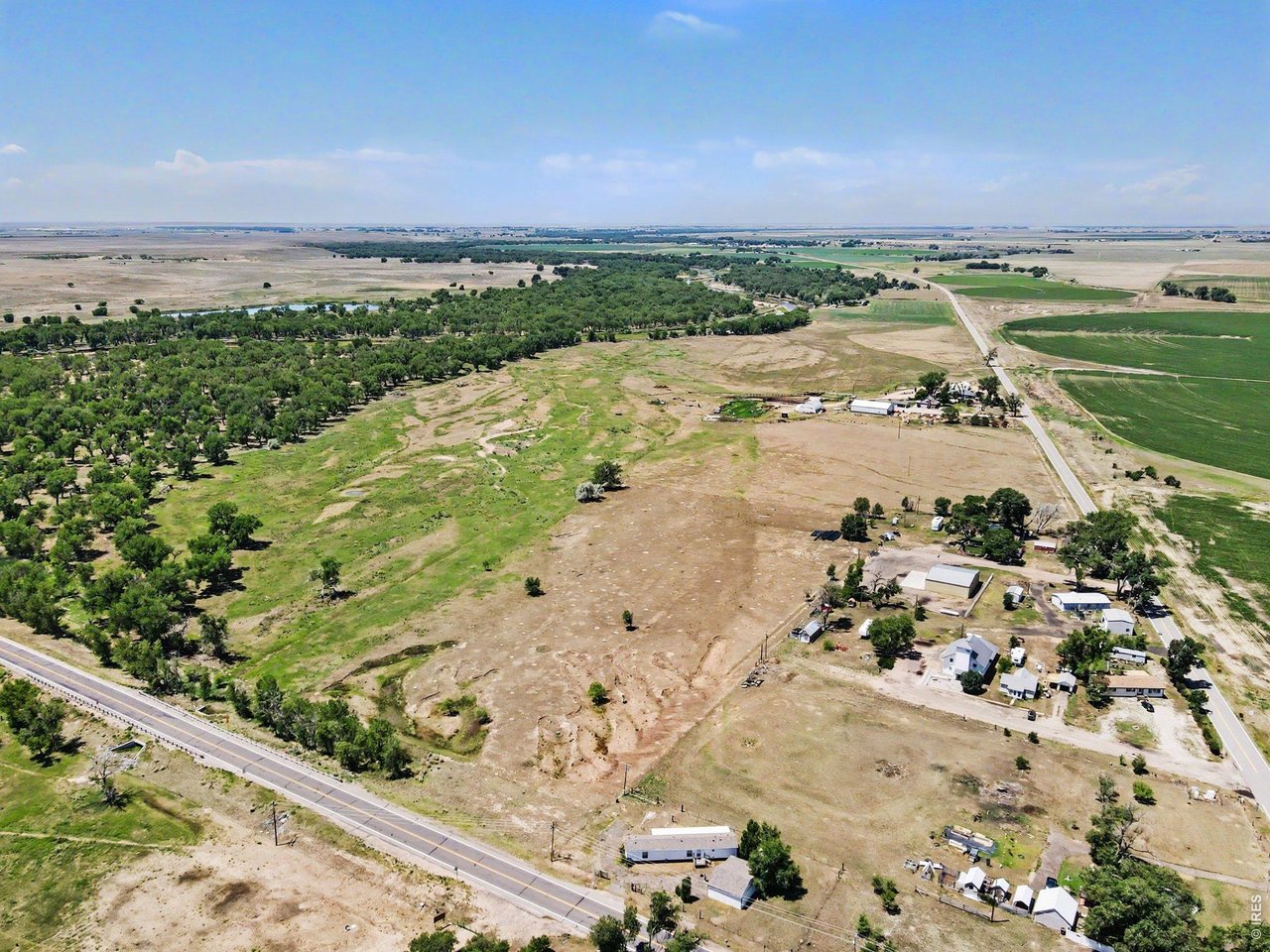 Property Photo 17 Aerial view looking to the west, showing the open space around the property.