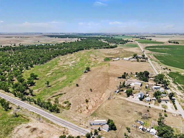 Property Photo 17 Aerial view looking to the west, showing the open space around the property.