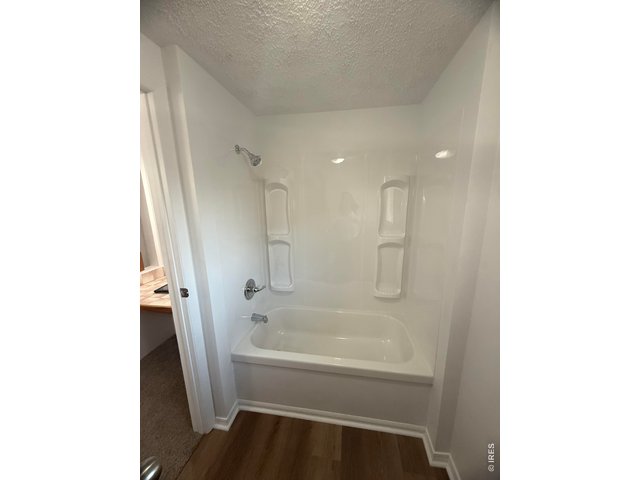Property Photo 17 Primary bathroom bathtub