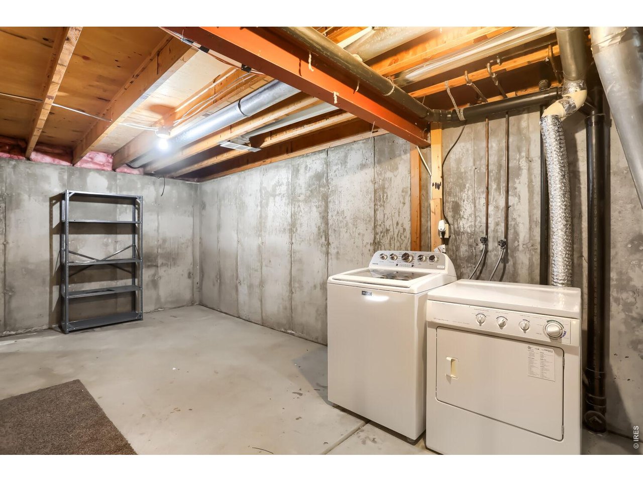 Unfinished basement with egress and framed for large rec room
