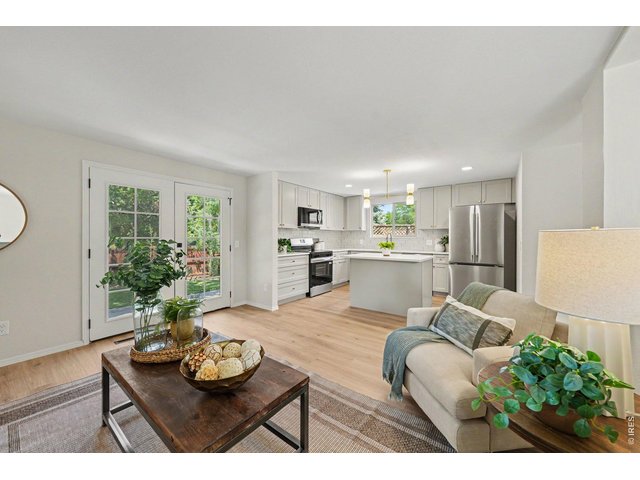 Property Photo 10 Seamless flow between the family room and updated kitchen.
