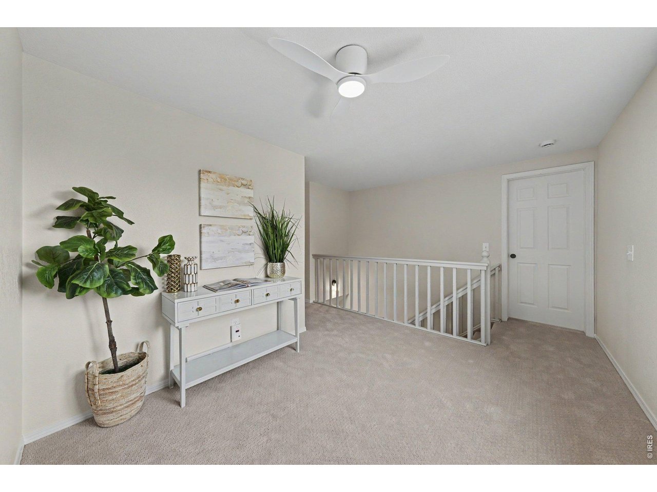 Property Photo 16 Spacious upper landing, revealing open doorways to the bright, newly carpeted bedrooms.