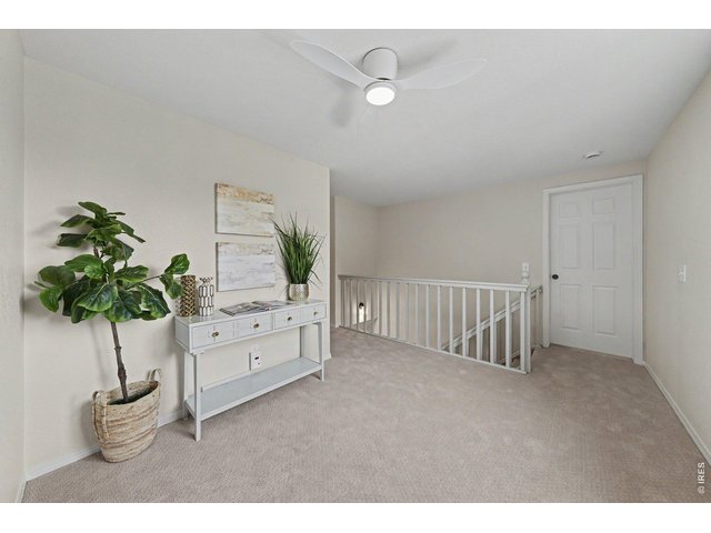 Property Photo 16 Spacious upper landing, revealing open doorways to the bright, newly carpeted bedrooms.