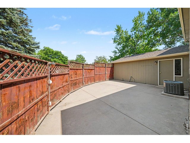 Property Photo 31 Private, fully enclosed low-maintenance concrete patio
