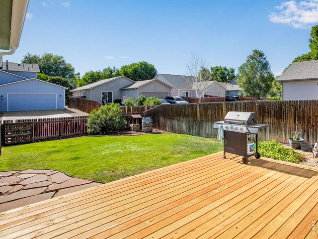 Property Photo 6 New wood deck with flagstone pathway