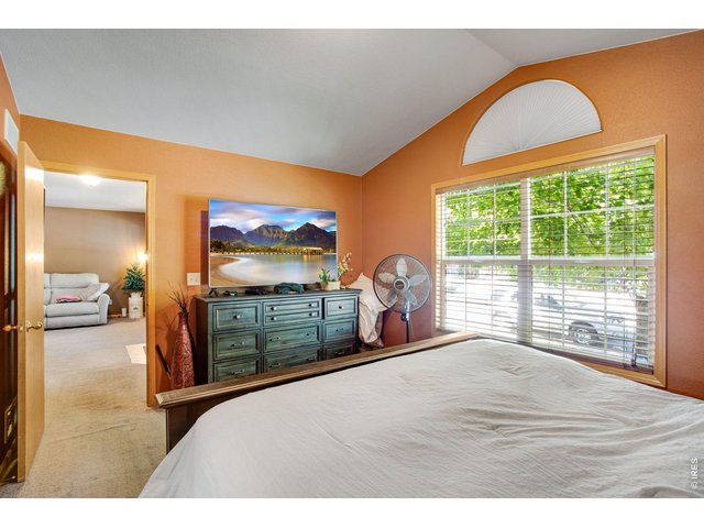Property Photo 22 Primary Bedroom with half-round arch window