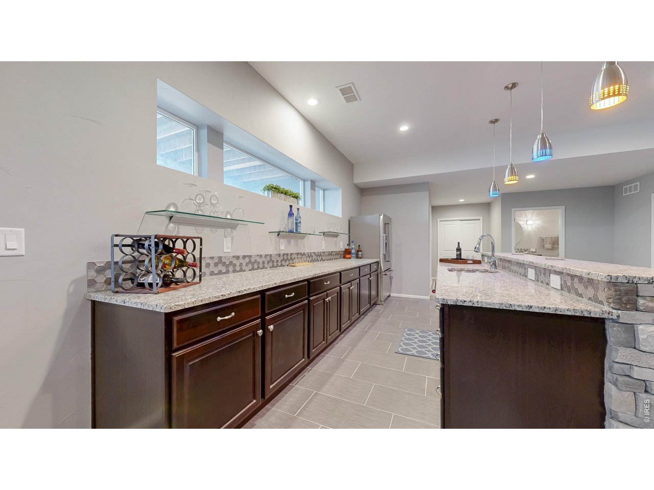 Property Photo 41 Large bar area with full sized refrigerator and dishwasher