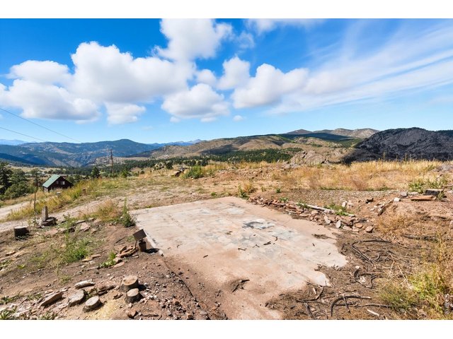 Property Photo 4 Site had a home on it that was burned down. Septic Vault system and well still on the property and functioning. Also, electricity is to the property. This is a site ready for your build!