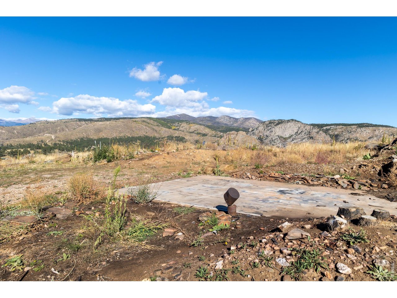 Property Photo 22 Concrete pad and well head pictured. Well is a huge value add. Well company said this could easily 60K savings for next owner.