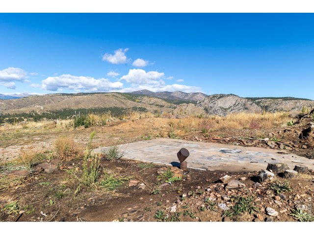 Property Photo 22 Concrete pad and well head pictured. Well is a huge value add. Well company said this could easily 60K savings for next owner.