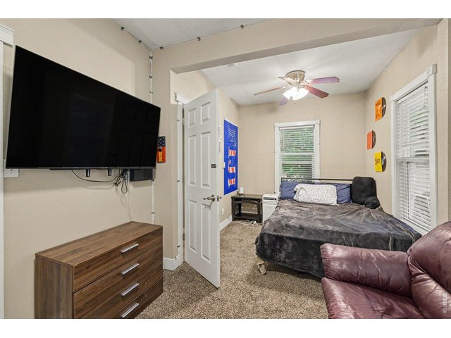 Property Photo 10 Primary Bedroom with Shared Ensuite 3/4 Bathroom