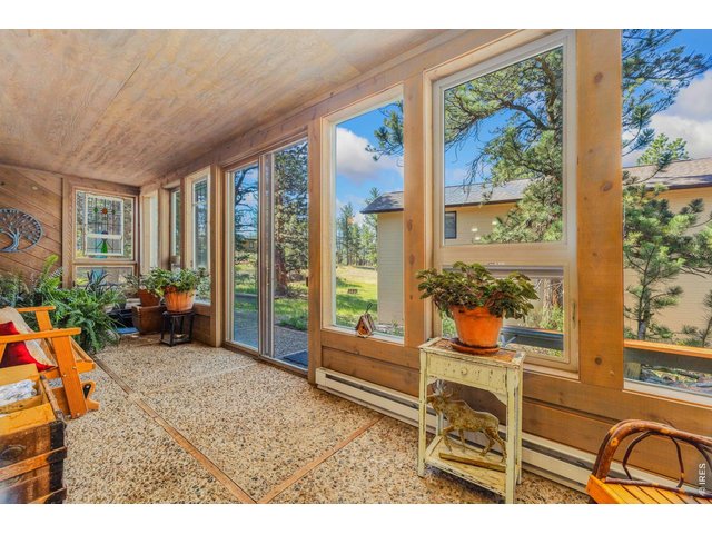 Property Photo 9 Main level heated sunroom