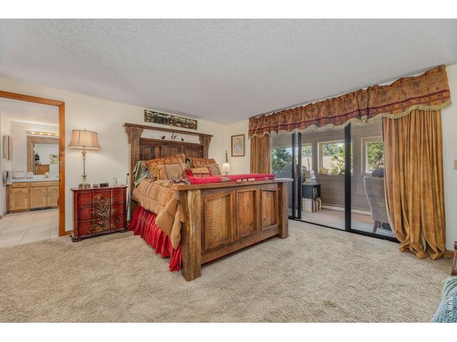 Property Photo 27 Primary Suite with access to heated sunroom
