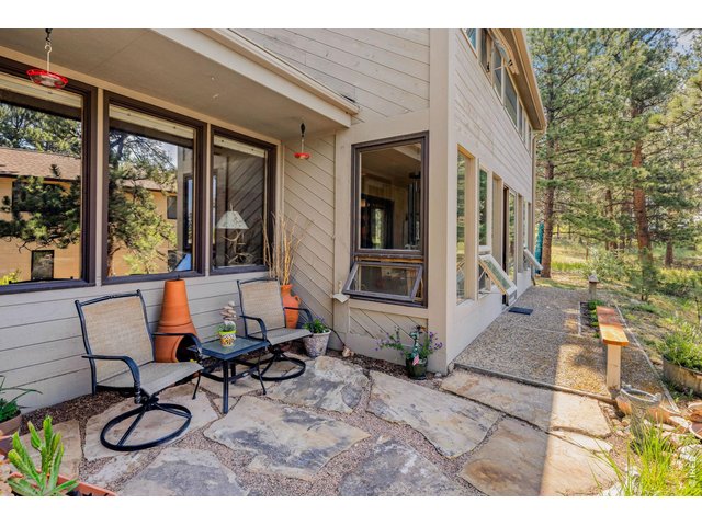 Property Photo 12 Side Patio next to sunroom