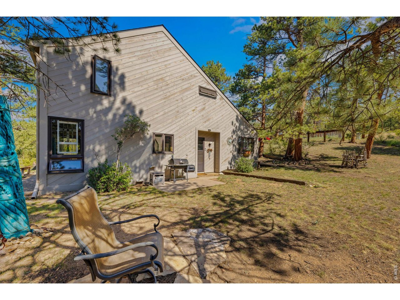 Back of home, adjacent to open space
