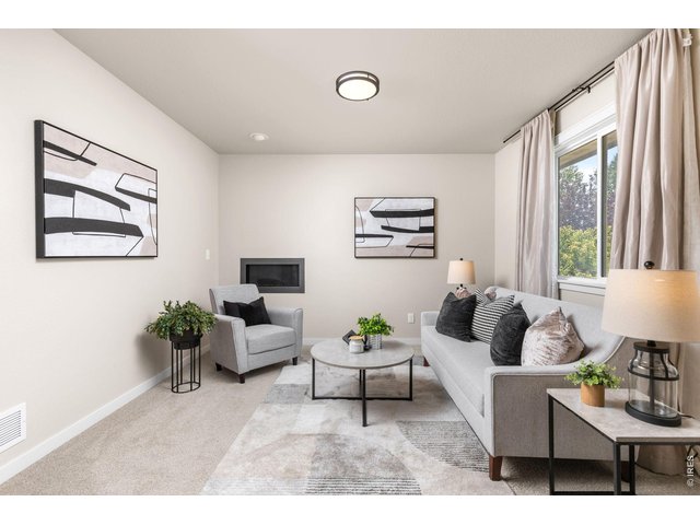 Property Photo 16 Sitting area with fireplace in primary bedroom